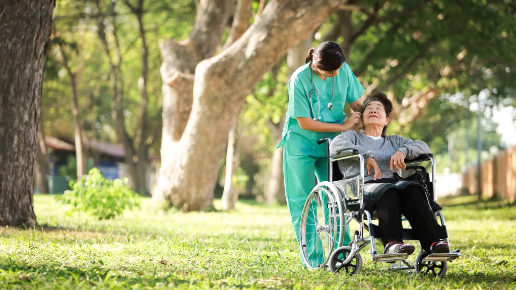 One Life Foundation Disability Services Provider Asian Senior Woman Sitting On The Wheelchair With Woman In Doct